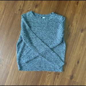 Blue, white, and navy colored knitted sweater.